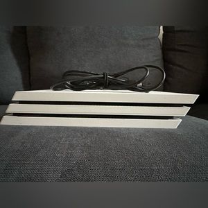 Selling a PS4 pro, the color is white, no scratches, It still has power cords.